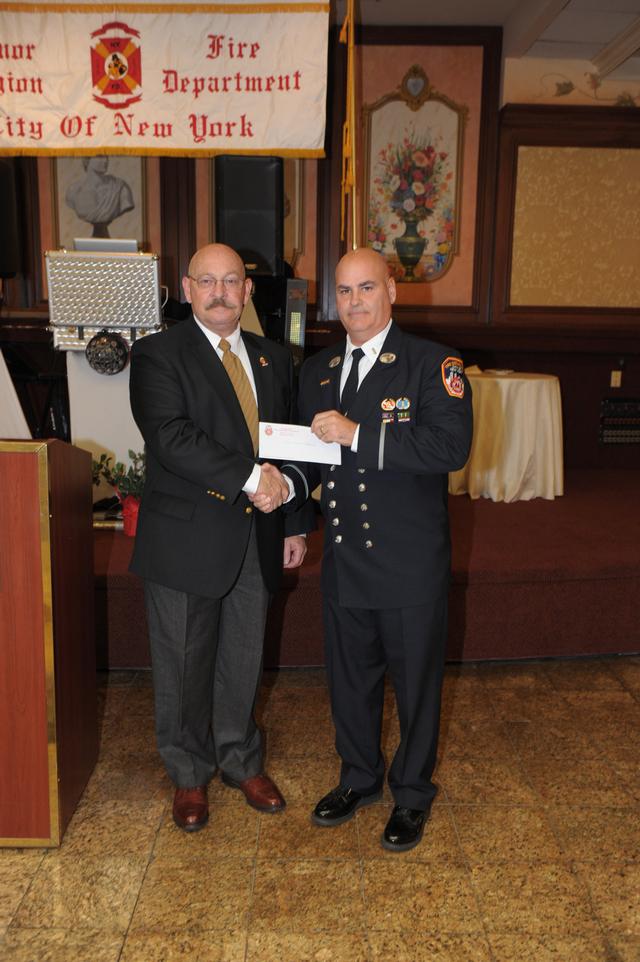 NY State Honorary Fire Chiefs
President Michael Hill presents a donation check to President Paul Mastronardi