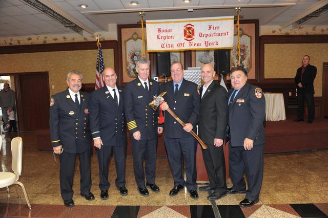 Fr. Dan Ward (Treasurer) is presented a Retirement Gift from Honor Legion by Commissioner Sal Cassano, Chief Edward Kilduff and Honor Legion Board